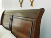 Trellington - Queen Sleigh Storage Bed - Brown - Tallahassee Discount Furniture (FL)
