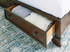 Trellington - Queen Sleigh Storage Bed - Brown - Tallahassee Discount Furniture (FL)