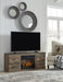 Trinell - Brown - TV Stand With Electric Fireplace - Tallahassee Discount Furniture (FL)