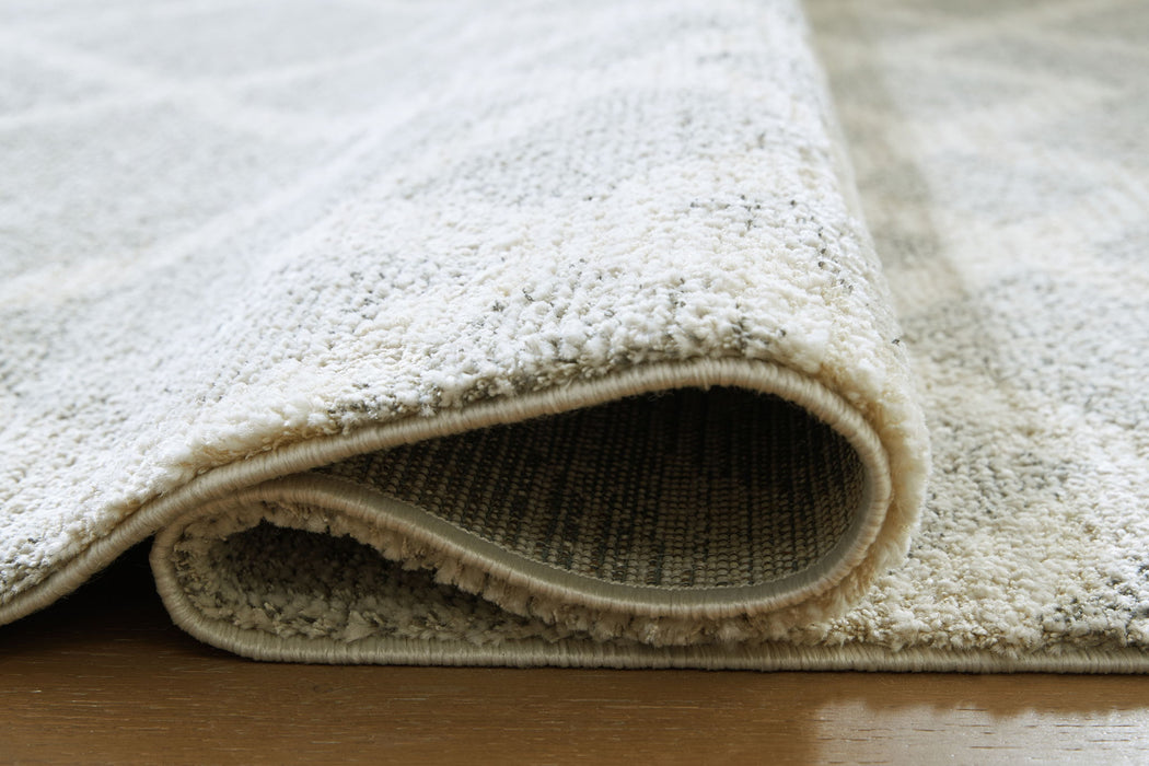 Unawick - Rug - Tallahassee Discount Furniture (FL)