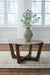 Tanidore - Warm Brown - Round Cocktail Table - Tallahassee Discount Furniture (FL)
