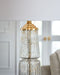 Bakersboro - Clear / Gold Finish - Glass Table Lamp - Tallahassee Discount Furniture (FL)