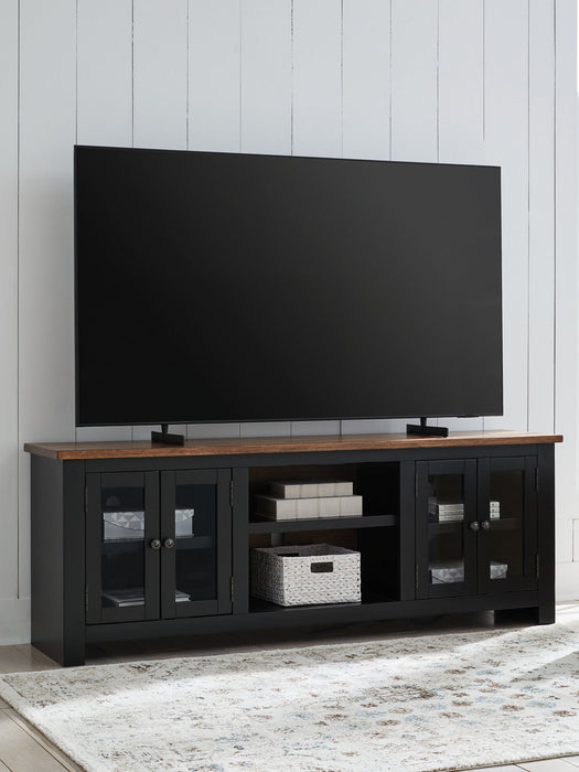 Wildenauer - Brown / Black - XL TV Stand With Fireplace Option - Tallahassee Discount Furniture (FL)