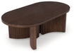 Korestone - Dark Brown - Oval Cocktail Table - Tallahassee Discount Furniture (FL)